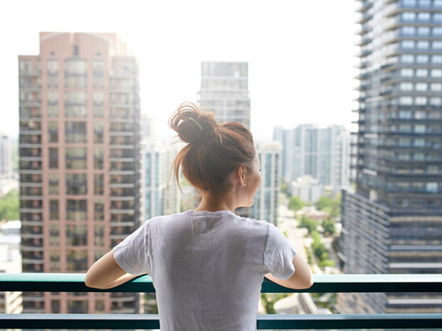A condo buyer looking over a city neighbourhood