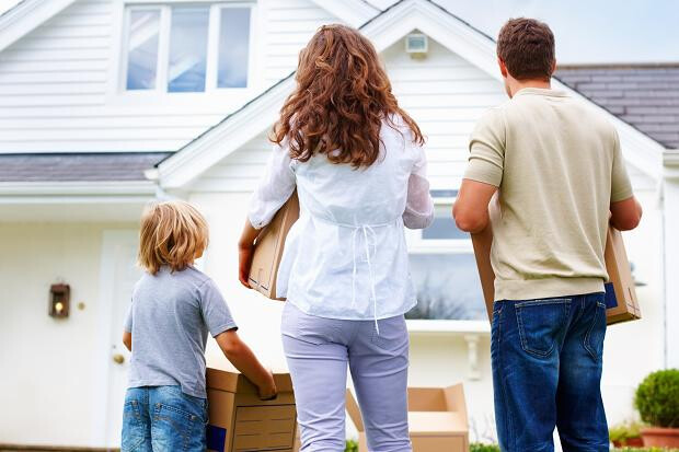 A family arriving at their house